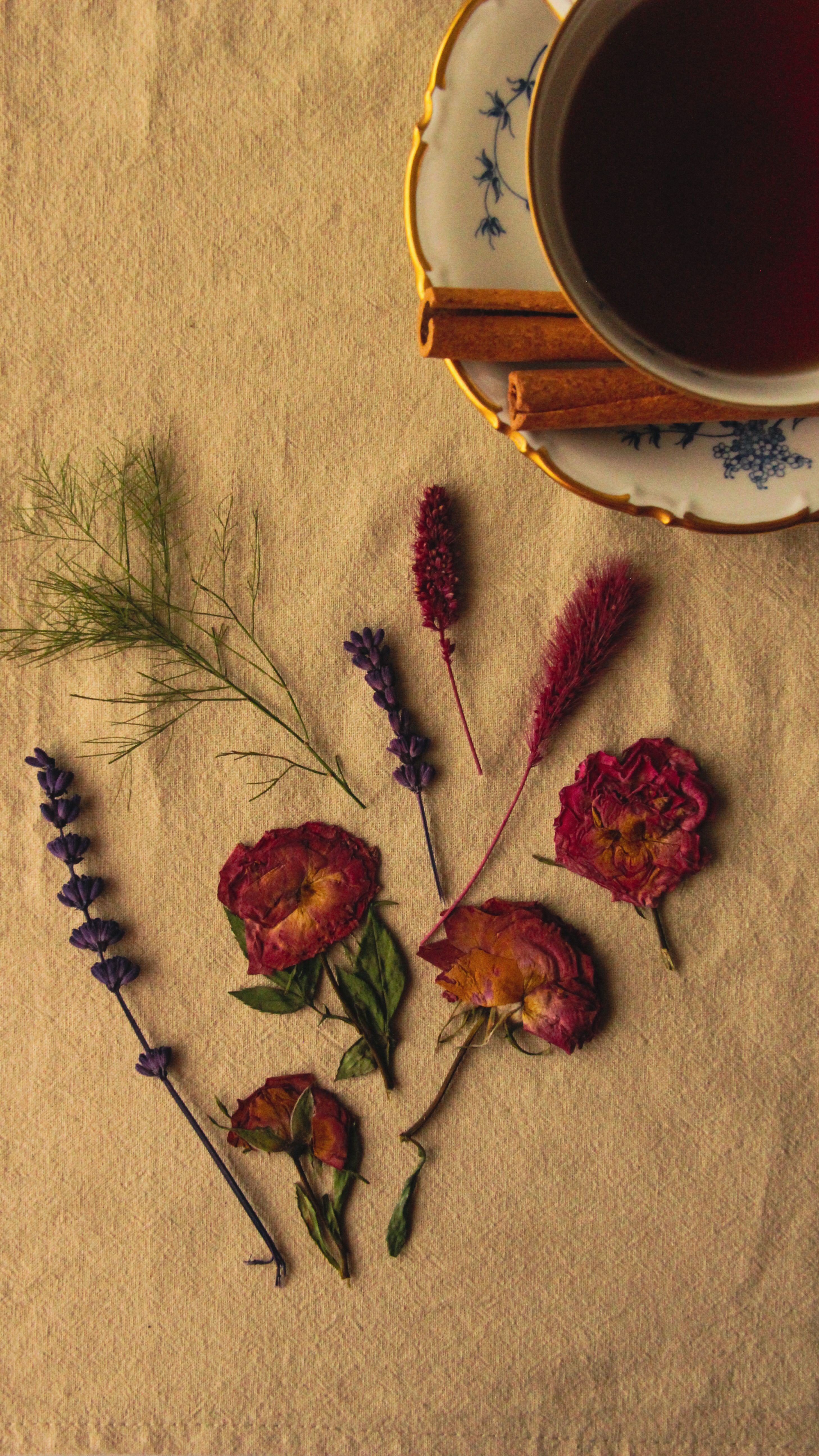 Unbranded tea still life with cinnamon and dried flowers